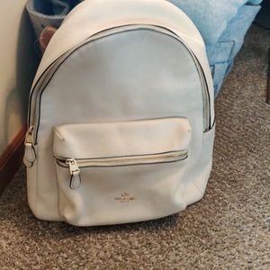 White leather authentic coach backpack and wallet
